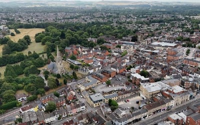 An aerial view of a residential area of Swindon, including a church spire