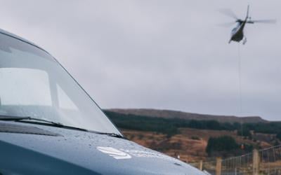 An SSEN response vehicle with a helicopter flying overhead