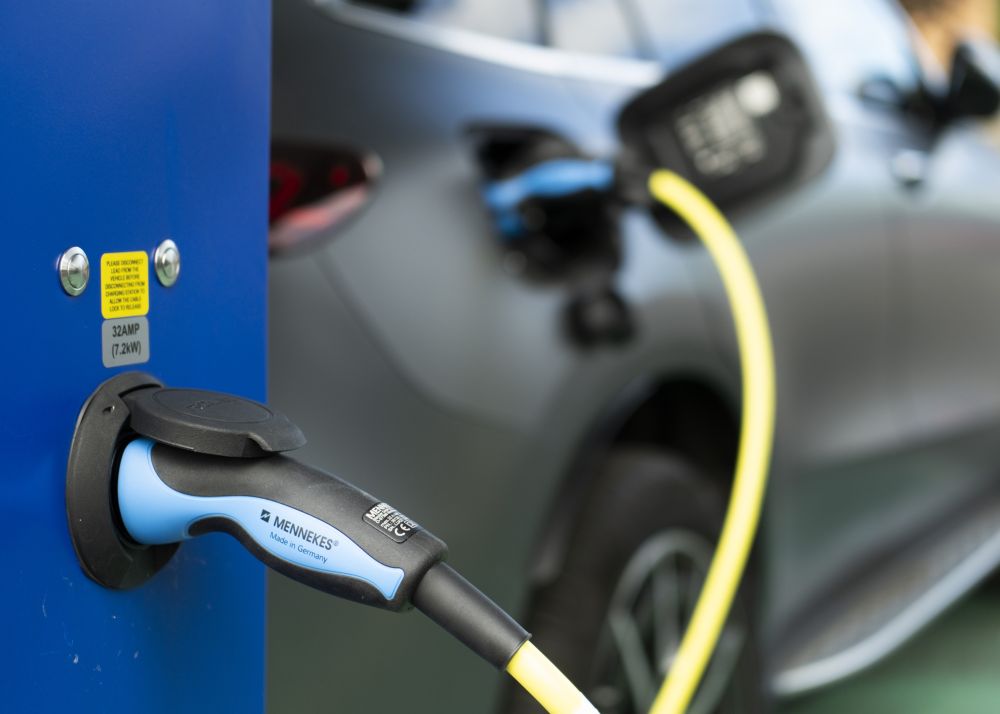 An electric vehicle being charged by a public charger