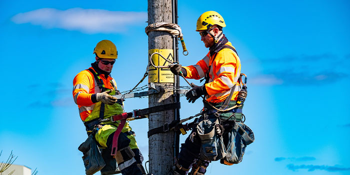 Linesperson working on pole