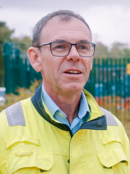 A photo of project director Neil Hitchcock wearing a hi-vis jacket A photo of project director Neil Hitchcock wearing a hi-vis jacket