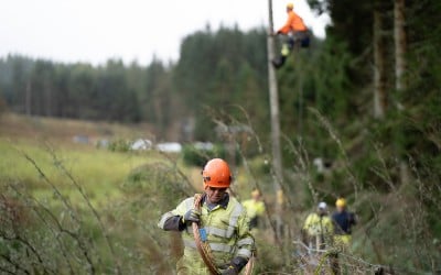 A storm response team making network repairs