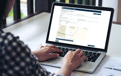 A customer using the Self-Serve Connections platform on their laptop computer