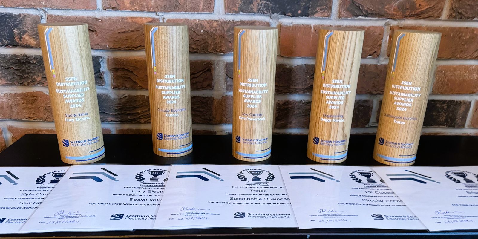 A close-up photo of the awards trophies and certificates