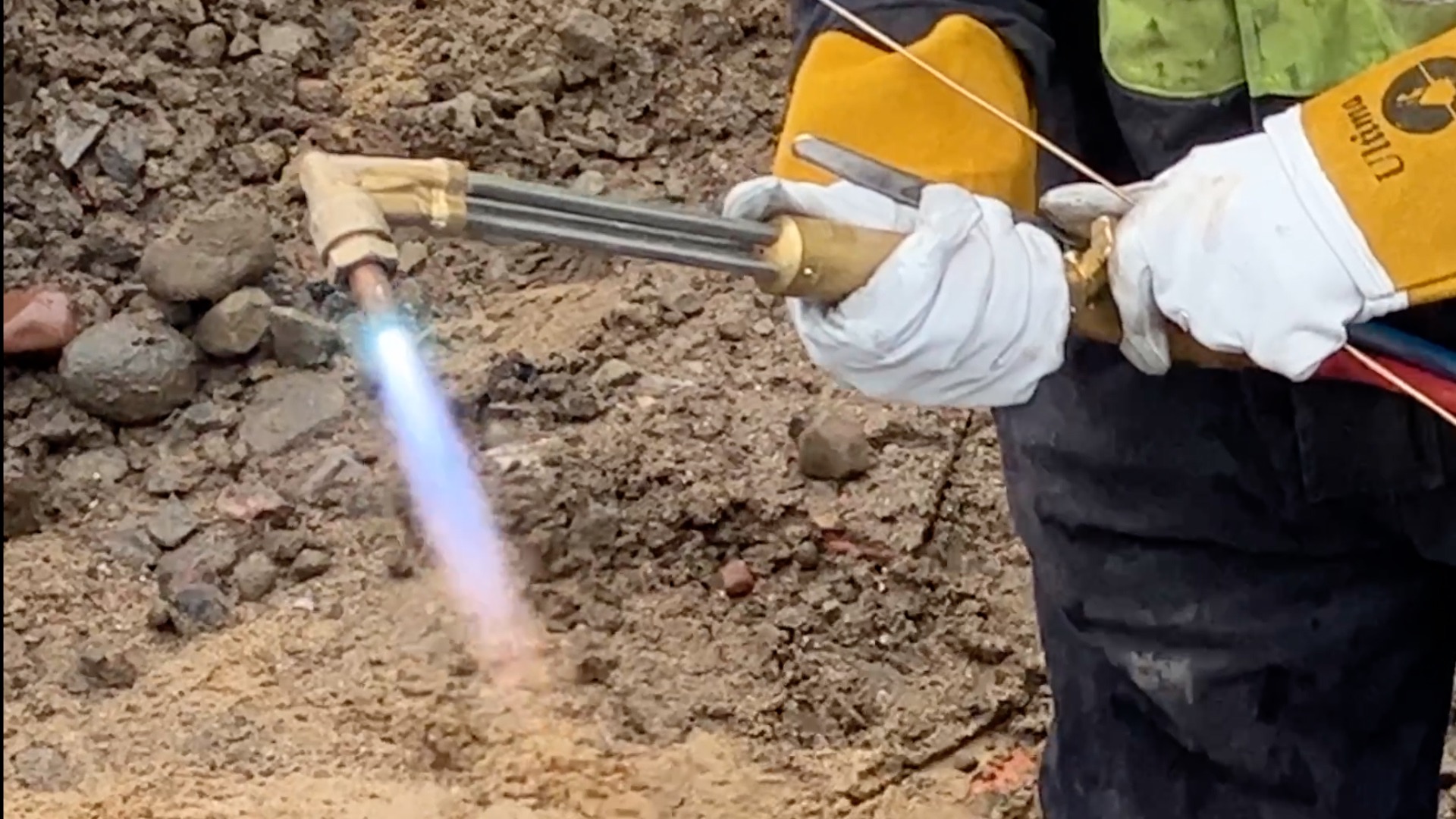Engineer using blowtorch