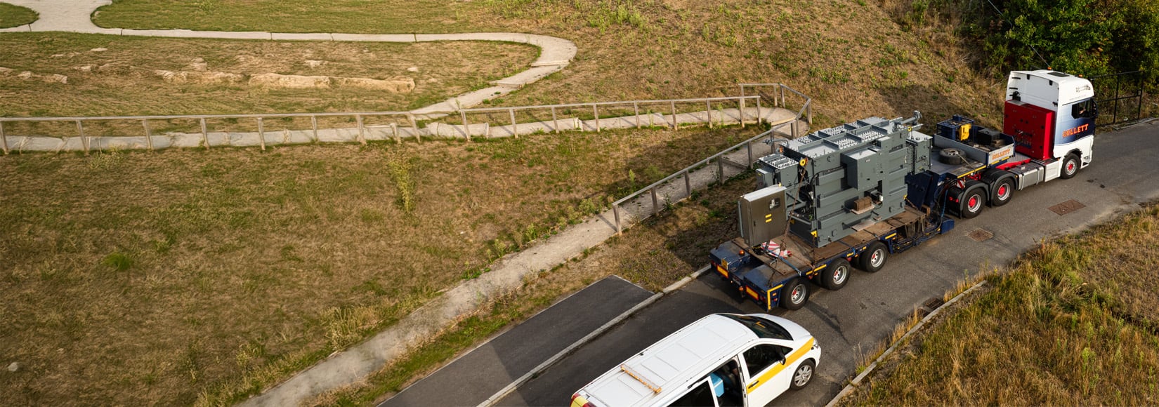 An aerial image of one of two new transformers being delivered in Chertsey via lorry