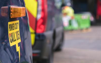 An out of focus shot of an SSEN team attending to road works in the background