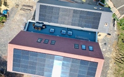 An aerial view of a community hub with solar panels installed with an SSEN grant