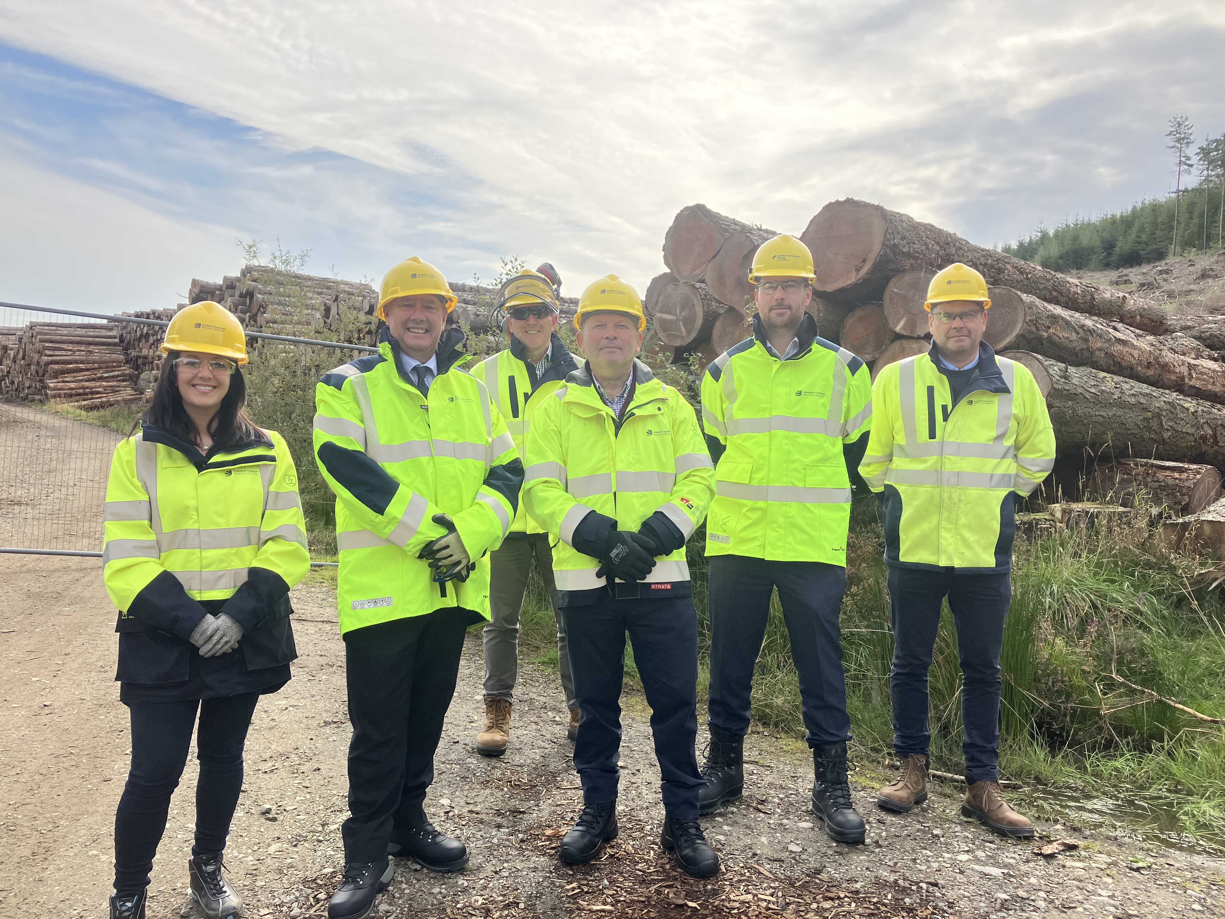 Cabinet Secretary for Justice and Lead Minister for Resilience, Keith Brown MSP, with representatives from SSEN Distribution in Pitfichie Forest in Aberdeenshire