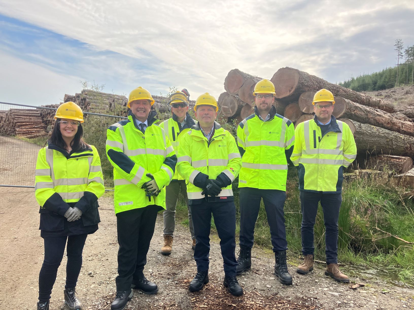 Cabinet Secretary for Justice and Lead Minister for Resilience, Keith Brown MSP, with representatives from SSEN Distribution in Pitfichie Forest