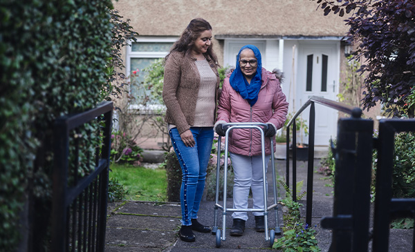 Customer walking up path