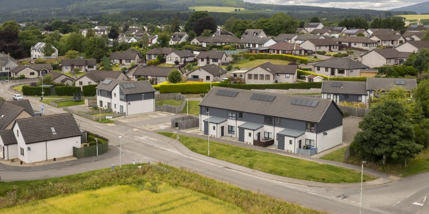 An aerial view of newly-built homes featuring low-carbon technologies