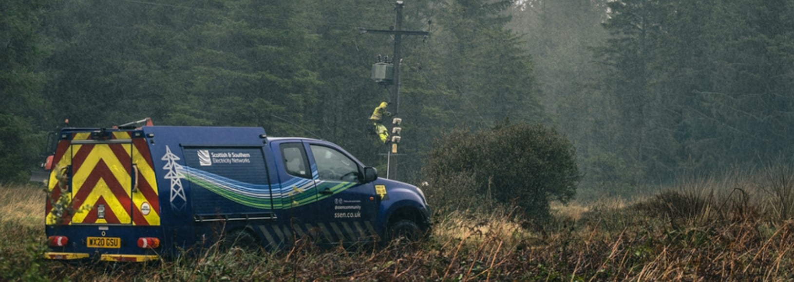 Image of SSEN engineer working on overhead network during storm conditions
