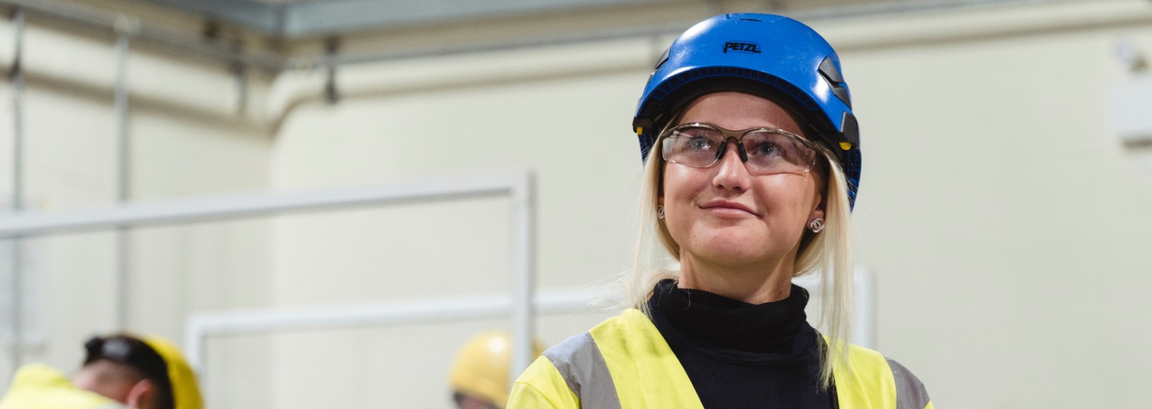 Engineer smiling at camera in street