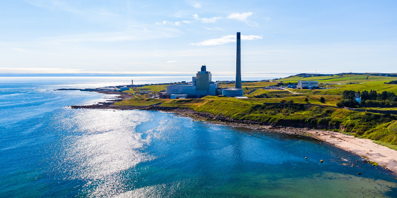 Coastal line of a Scottish Island with a power station in the background