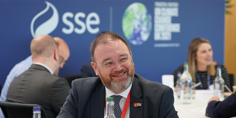 Picture shows; SSEN employee smiling at COP26 event