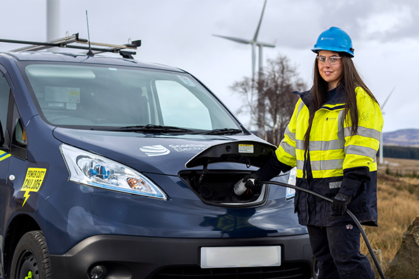 SSEN employee standing with electric vehicle 