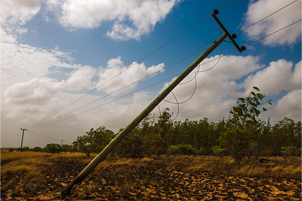 Image of a damaged electricity pole due to a vehicle coming into contact with it