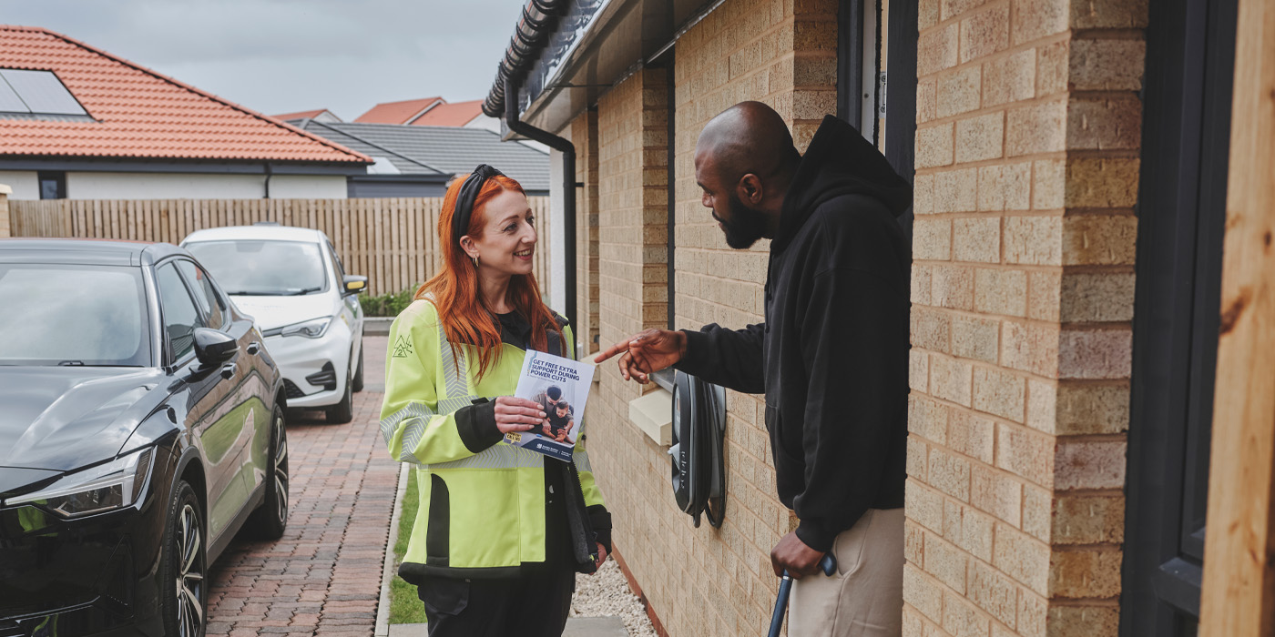 SSEN Staff member at customers door with PSR leaflet