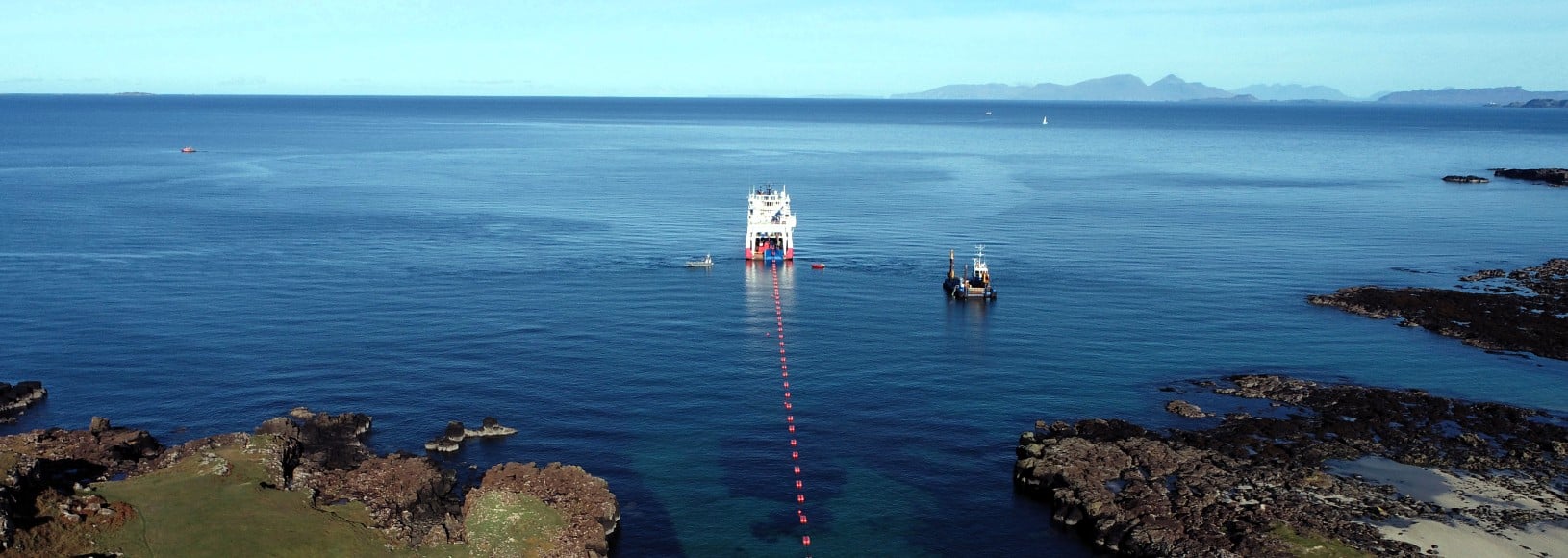A cable-laying vessel sailing in the waters off Mull, viewed from above