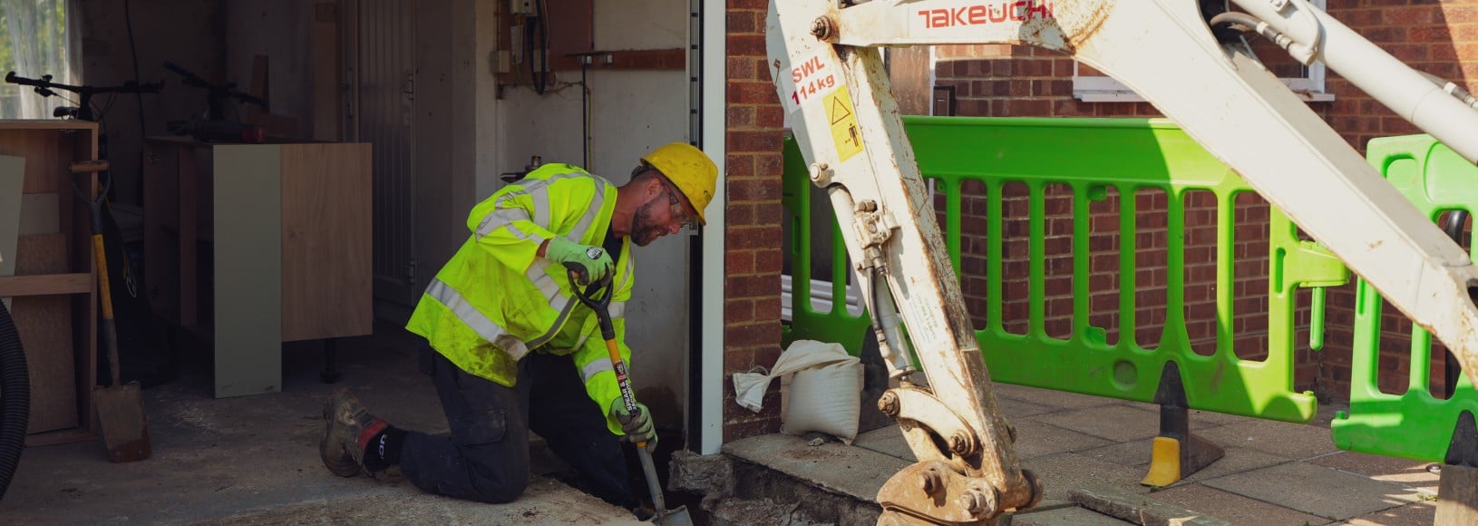 SSEN engineers work in a domestic property's garage to unloop an electricity supply